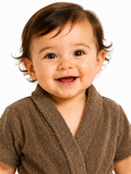 A close-up of a smiling baby wearing a brown textured bathrobe against a plain white background.