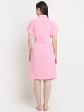Back view of a woman wearing a baby pink micro terry bathrobe with a tie belt