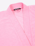 Close-up of a baby pink micro terry bathrobe showing the collar and fabric texture