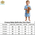 Child wearing a blue bathrobe holding a teddy bear with a Creeva logo, size chart below.