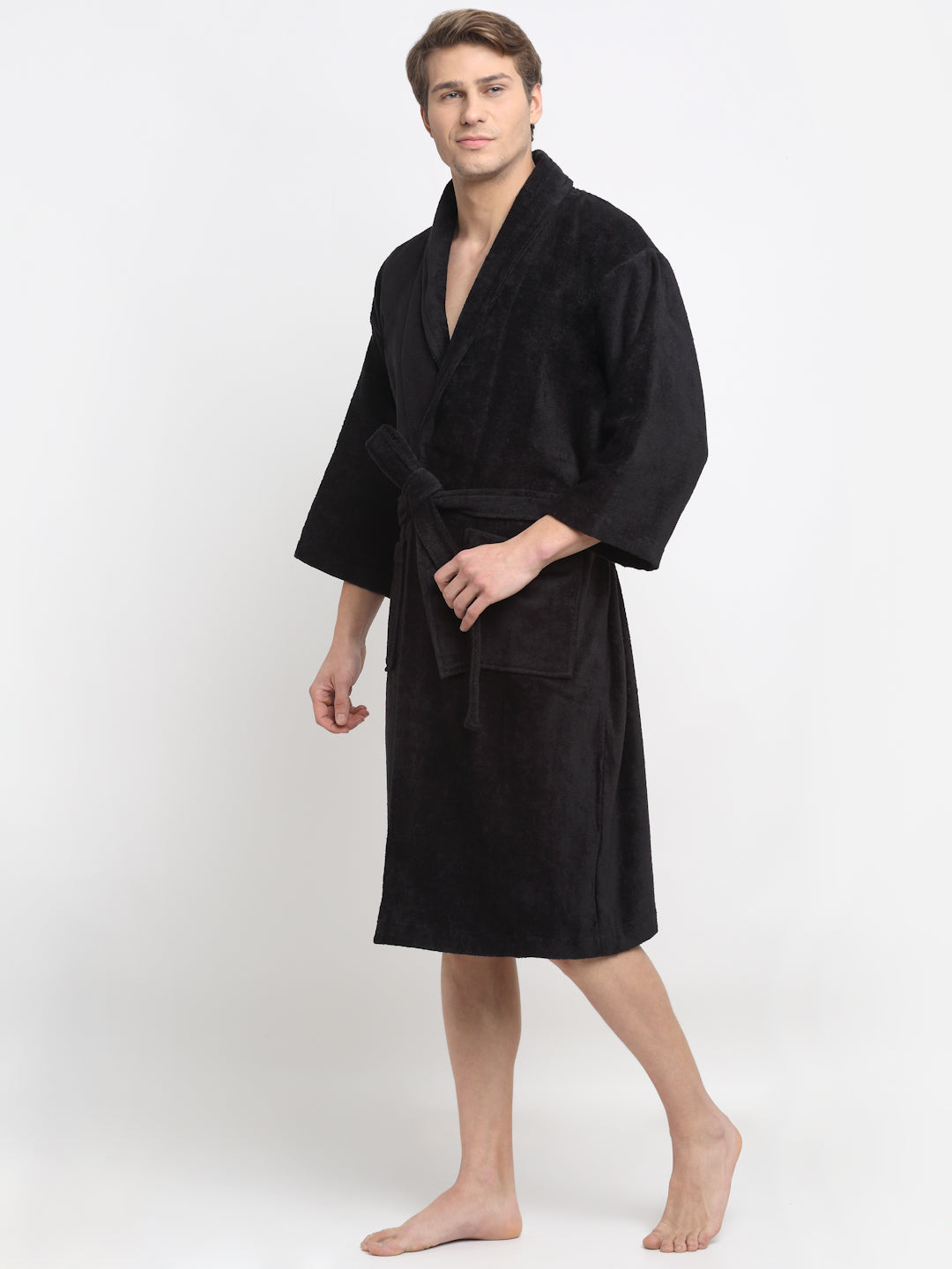 A Man wearing a black cotton bathrobe with a tie belt