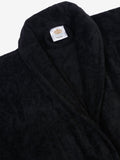 Close-up of a black cotton bathrobe showing the collar and fabric texture