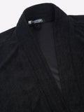 Close-up of a black micro terry bathrobe showing the collar and fabric texture