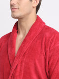 Close-up of a man wearing a crimson cotton bathrobe with a tie belt