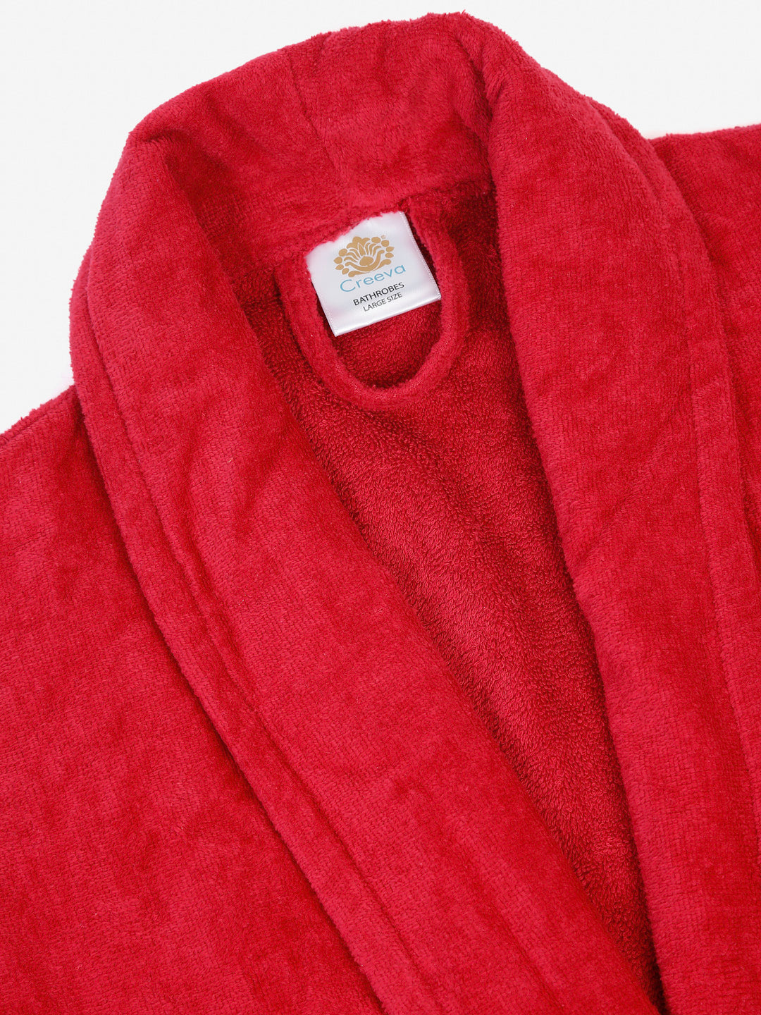 Close-up of a crimson cotton bathrobe showing the collar and fabric texture