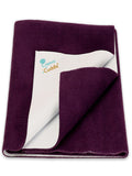 Purple blanket with white interior on a white background, featuring the 'Creeva Cuddle' brand.