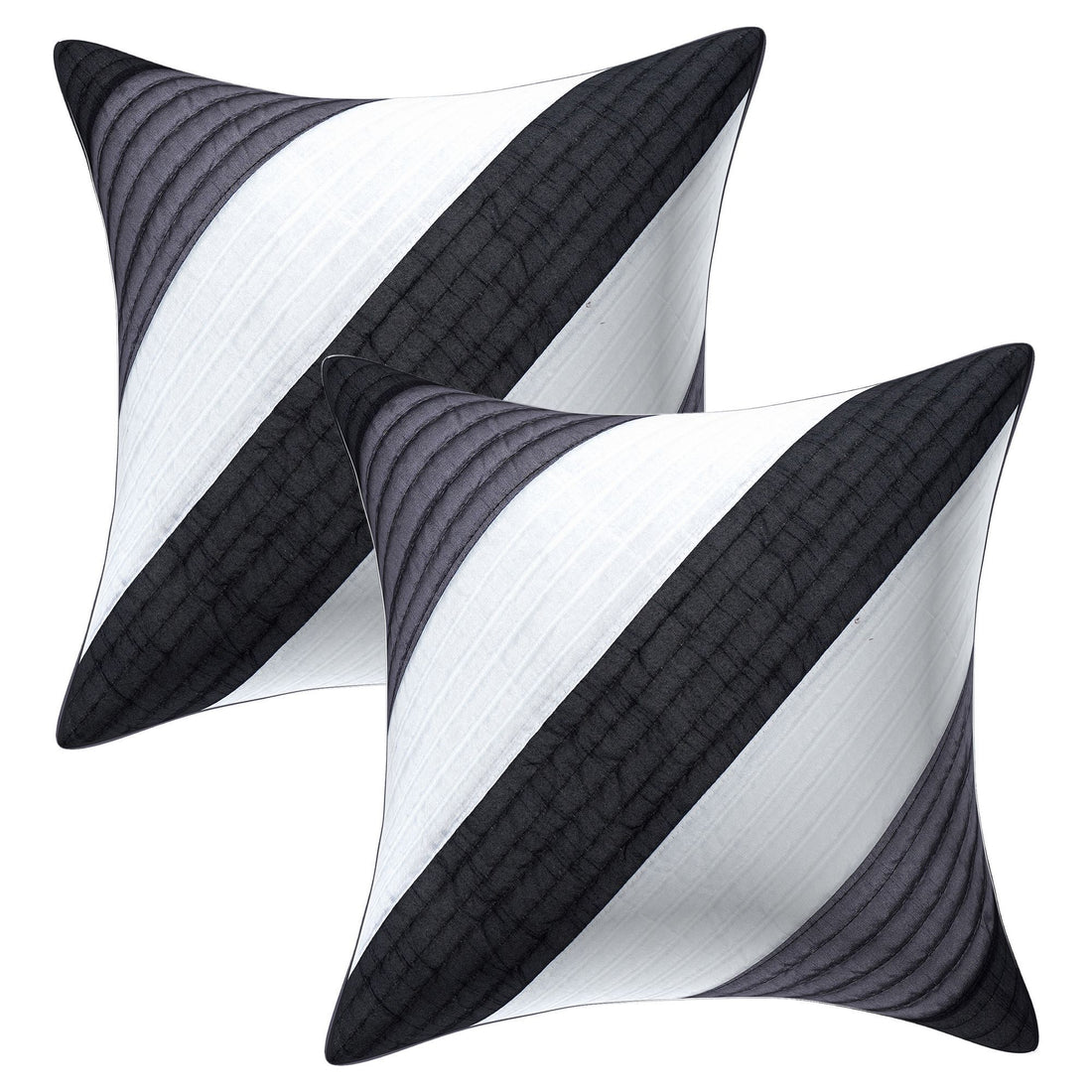 Decorative pillows with black and white striped pattern on a beige sofa in a living room setting.