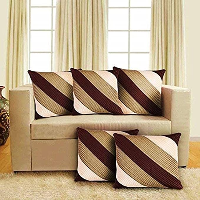 Beige sofa with striped brown and beige cushions in a living room setting.