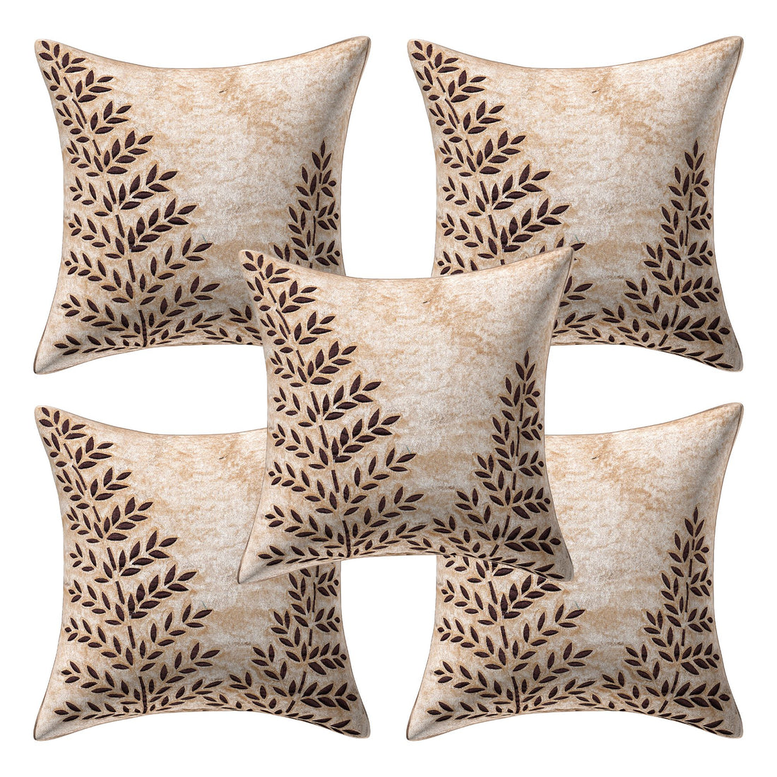 Decorative pillows with leaf pattern on a gray sofa in a living room setting.