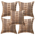 Set of four patterned pillows on a white background