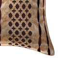 Close-up of a decorative pillow with brown geometric pattern on beige background