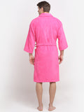 Back view of a man wearing a fuchsia cotton bathrobe with a tie belt