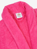 Close-up of a fuchsia cotton bathrobe showing the collar and fabric texture