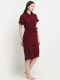 A Woman wearing a grape wine micro terry bathrobe with a tie belt