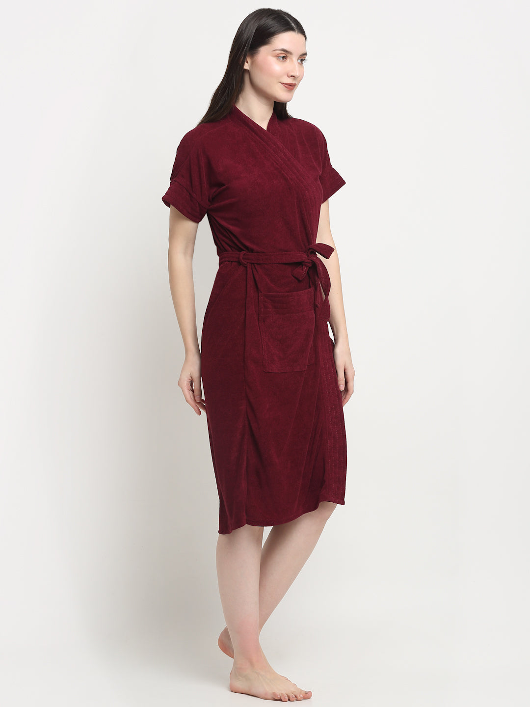 A Woman wearing a grape wine micro terry bathrobe with a tie belt