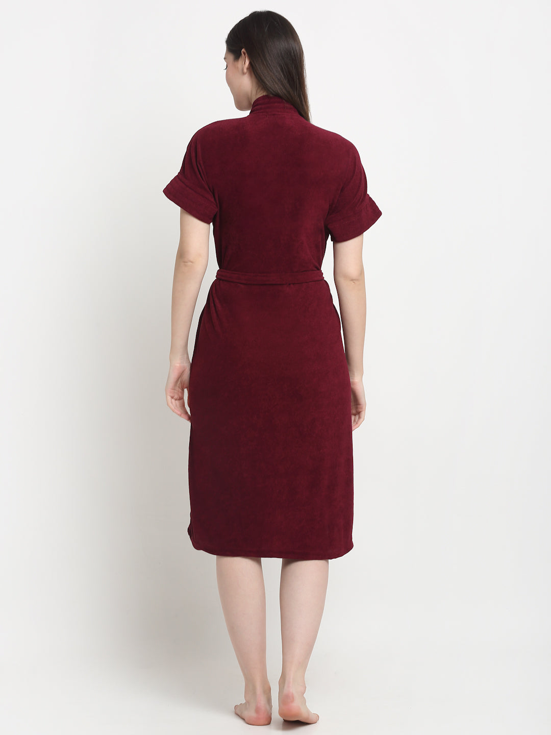 Back view of a woman wearing a grape wine micro terry bathrobe with a tie belt