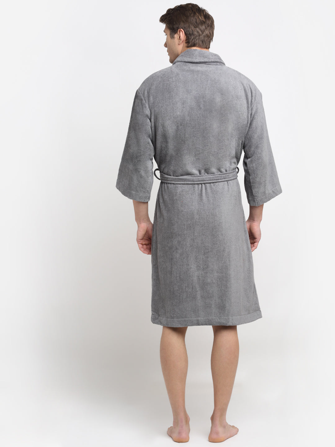 Back view of a man wearing a grey cotton bathrobe with a tie belt