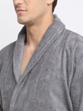 Close-up of a man wearing a grey cotton bathrobe with a tie belt