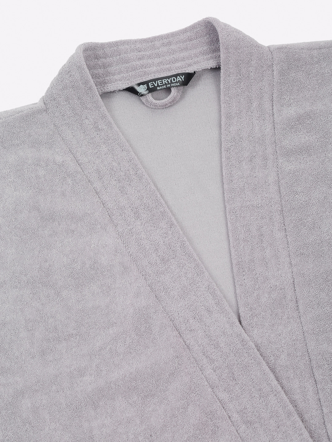 Close-up of a grey micro terry bathrobe showing the collar and fabric texture