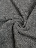 Grey cotton hand towel with a soft textured terry fabric surface.