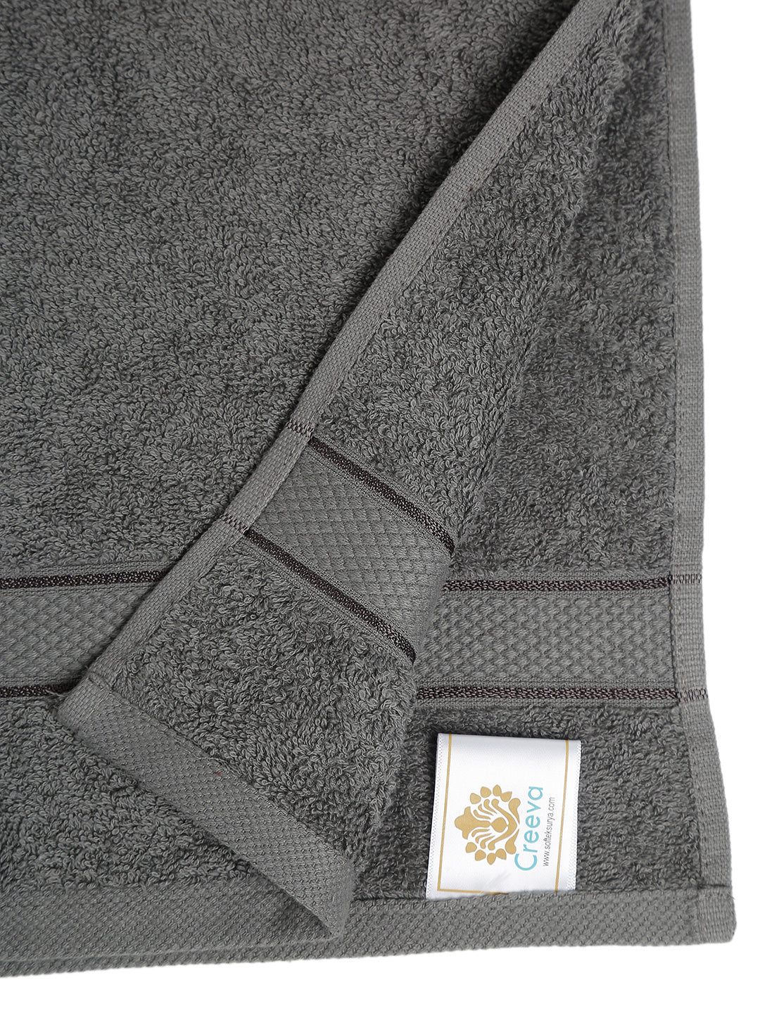 Grey cotton hand towel showing a close-up of the terry texture, decorative stripe detailing, and CREEVA label.
