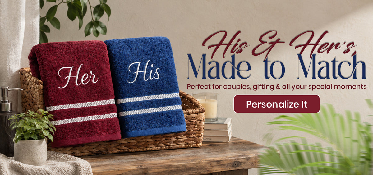 Two personalized towels in a woven basket on a wooden table, one maroon with a white stripe and the word 'Her', and one navy blue with a white stripe and the word 'His'. Large text reads 'His & Hers Made to Match' and 'Personalize It'.slider_item_hd9b9B