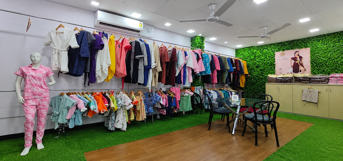 CREEVA showroom interior with bathrobes, loungewear and clothing displayed on racksslider_item_BwpWNd