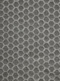 A close-up of a gray and black hexagonal woven fabric pattern with a textured, ribbed surface.