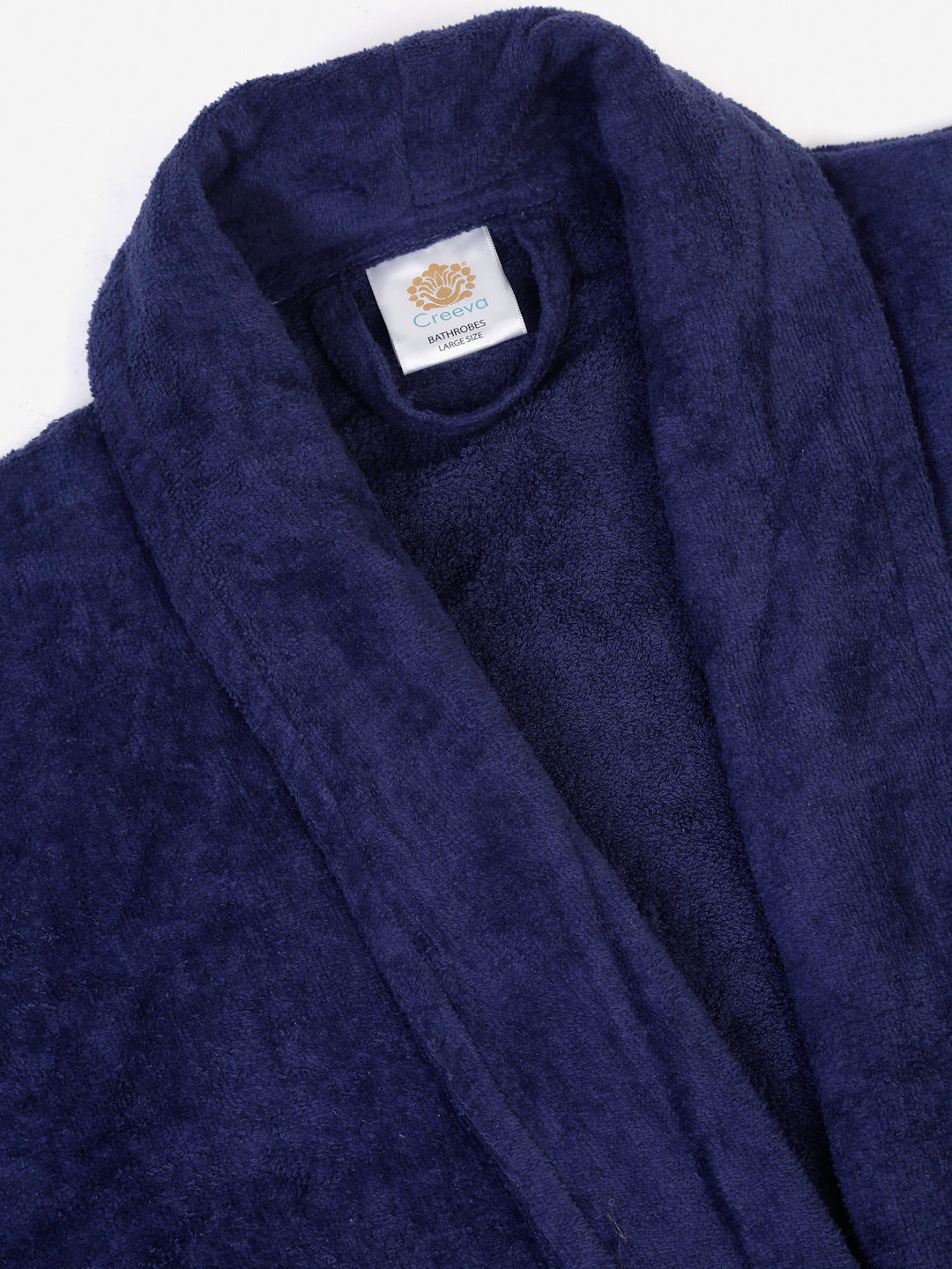 Close-up of a navy blue cotton bathrobe showing the collar and fabric texture