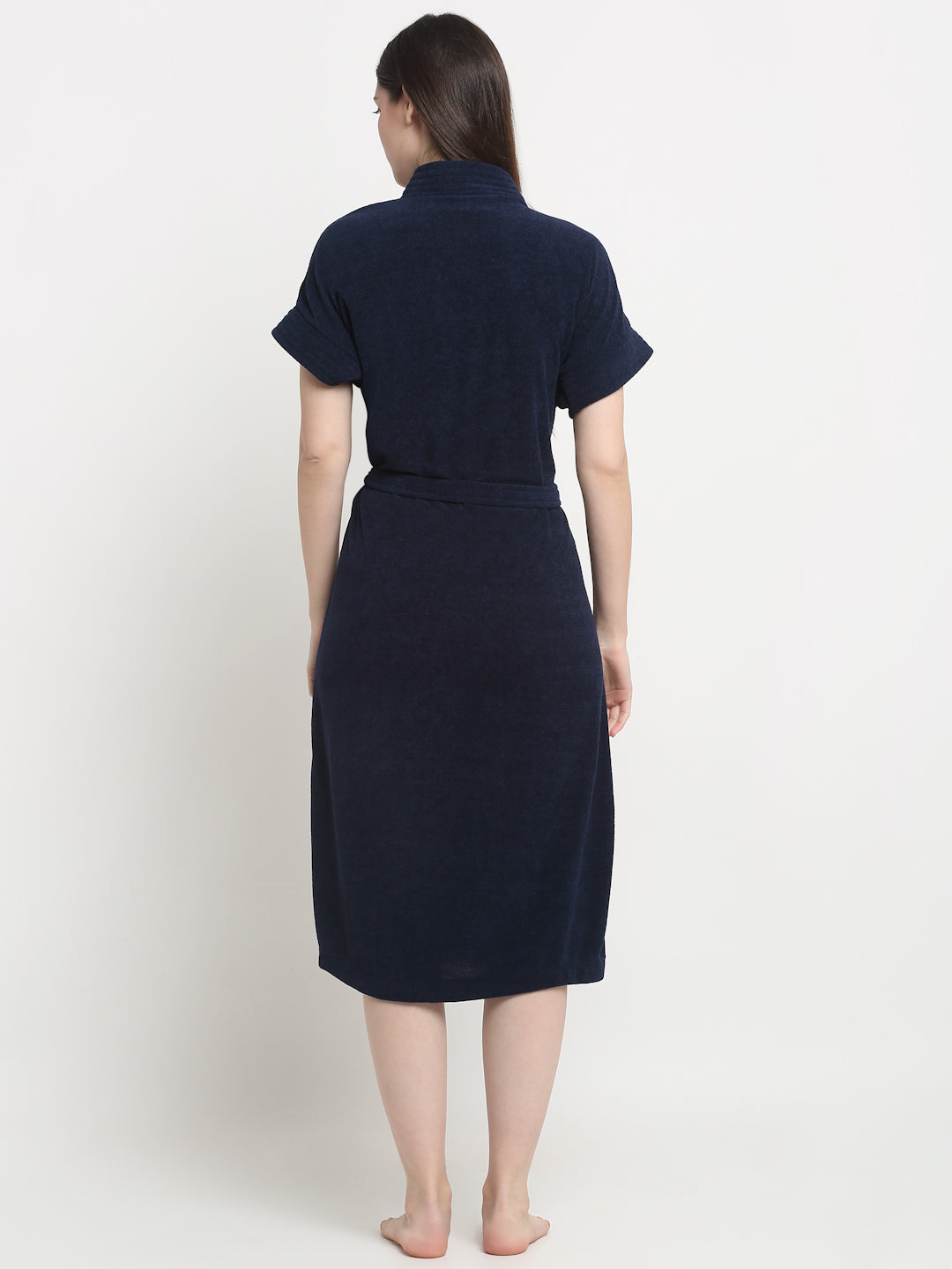 Back view of a woman wearing a Navy Blue micro terry bathrobe with a tie belt