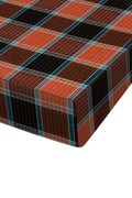 A close-up of a plaid fabric surface, likely a mattress or upholstered furniture corner, showing a tartan pattern in rust orange, dark brown, black, and teal on a white background.