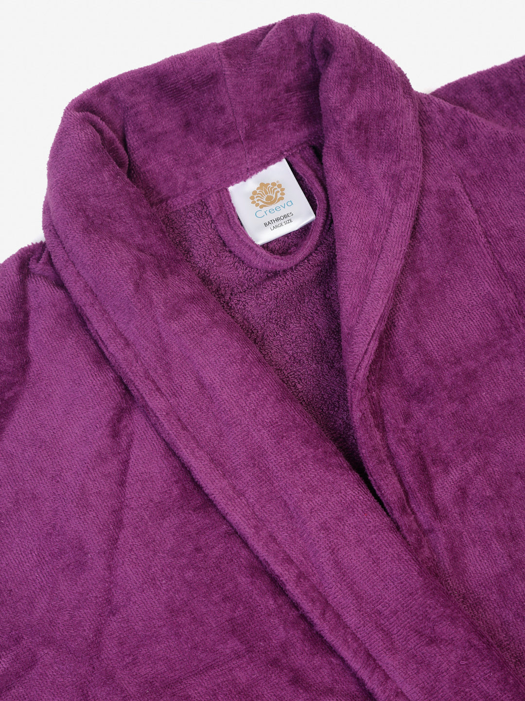 Close-up of a purple cotton bathrobe showing the collar and fabric texture