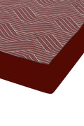 Red and Brown bed sheet corner on a white background