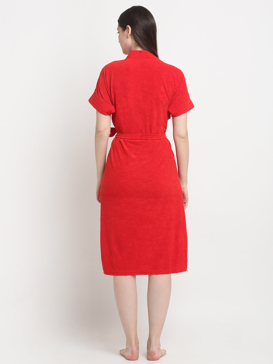 Back view of a woman wearing a red micro terry bathrobe with a tie belt