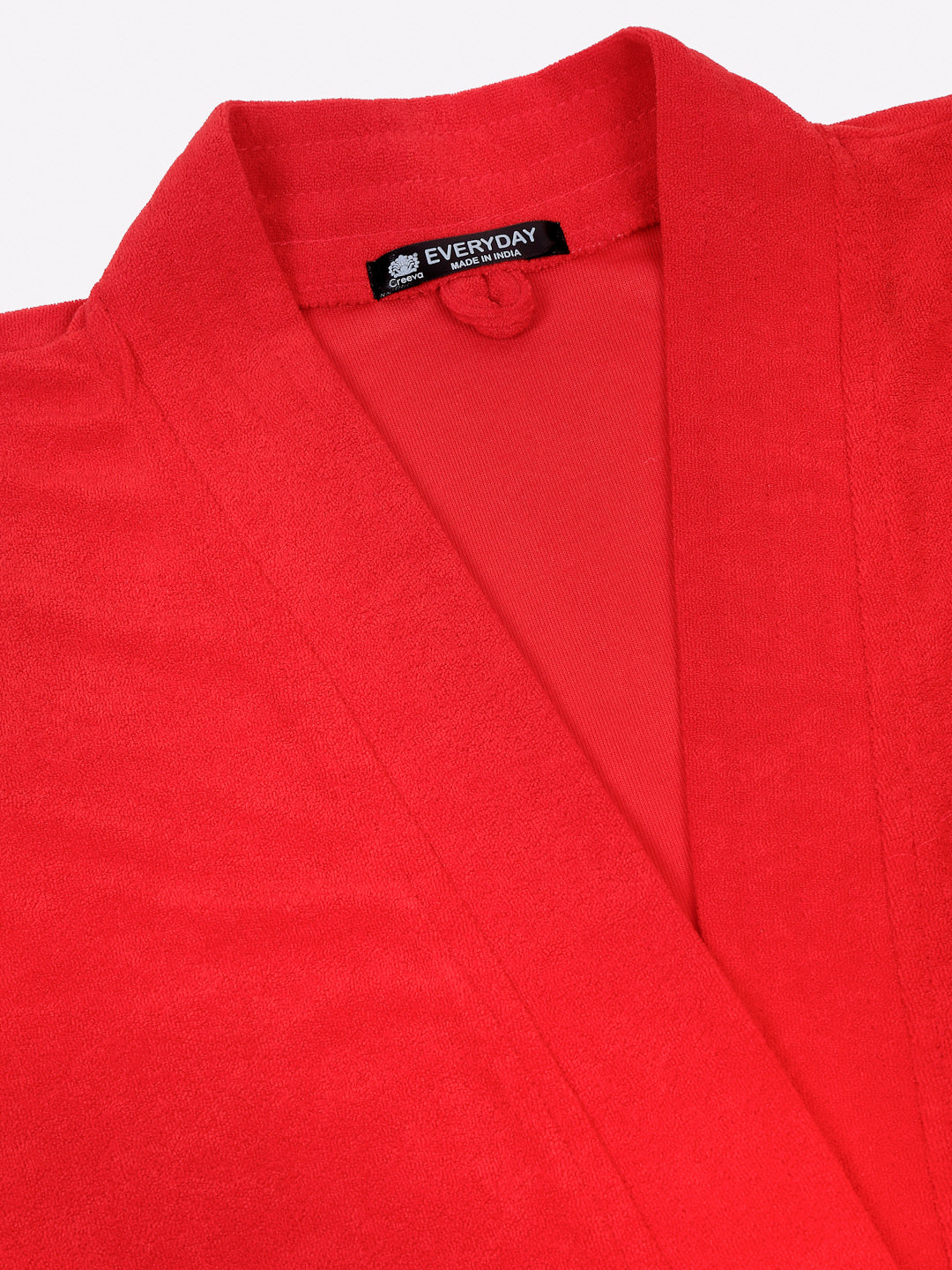 Close-up of a red micro terry bathrobe showing the collar and fabric texture