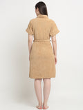 Back view of a woman wearing a Rust micro terry bathrobe with a tie belt
