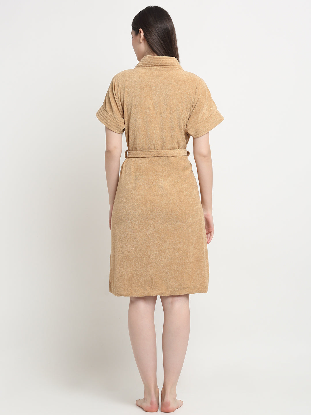 Back view of a woman wearing a Rust micro terry bathrobe with a tie belt
