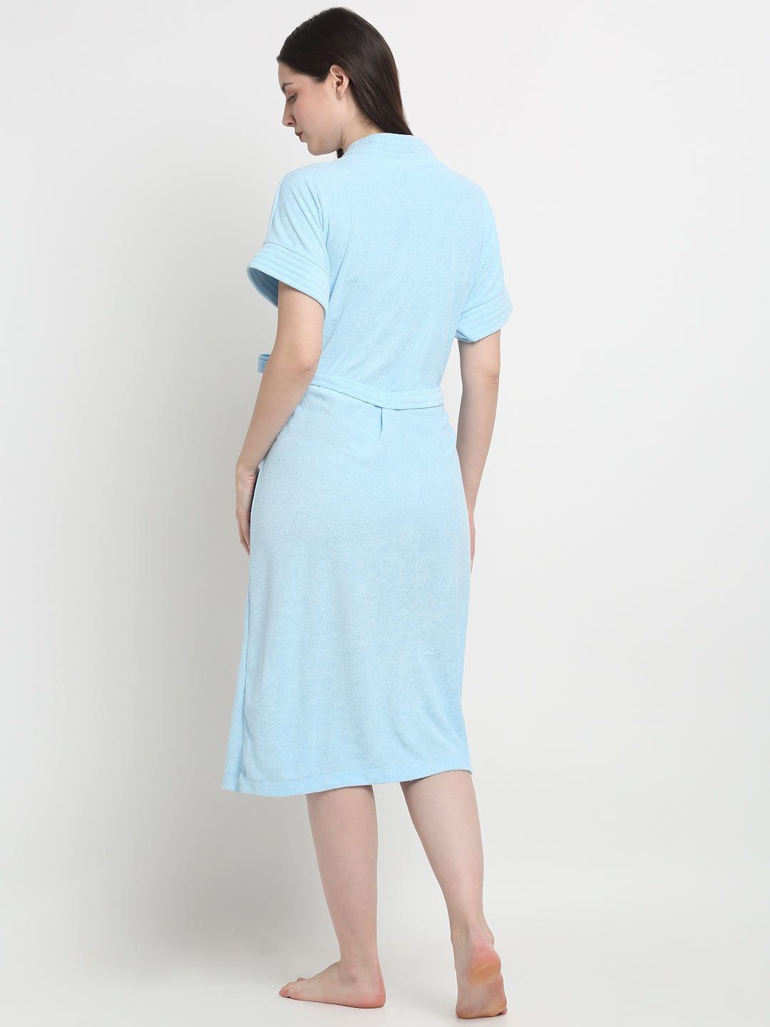 Back view of a woman wearing a Sky Blue micro terry bathrobe with a tie belt