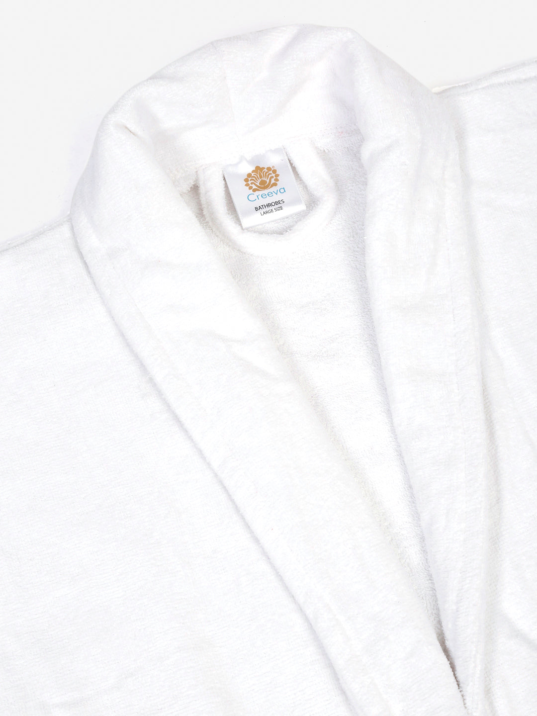 Close-up of a white cotton bathrobe showing the collar and fabric texture