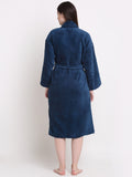 Back view of wearing a blue cotton bathrobe with a waist belt
