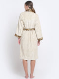 Back view of wearing a cream cotton with leopard print bathrobe with a waist belt