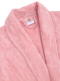 Close-up of a pink cotton bathrobe showing the shawl collar, soft terry texture, and CREEVA label