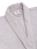 Close-up of a silver cotton bathrobe showing the shawl collar, soft terry texture, and CREEVA label